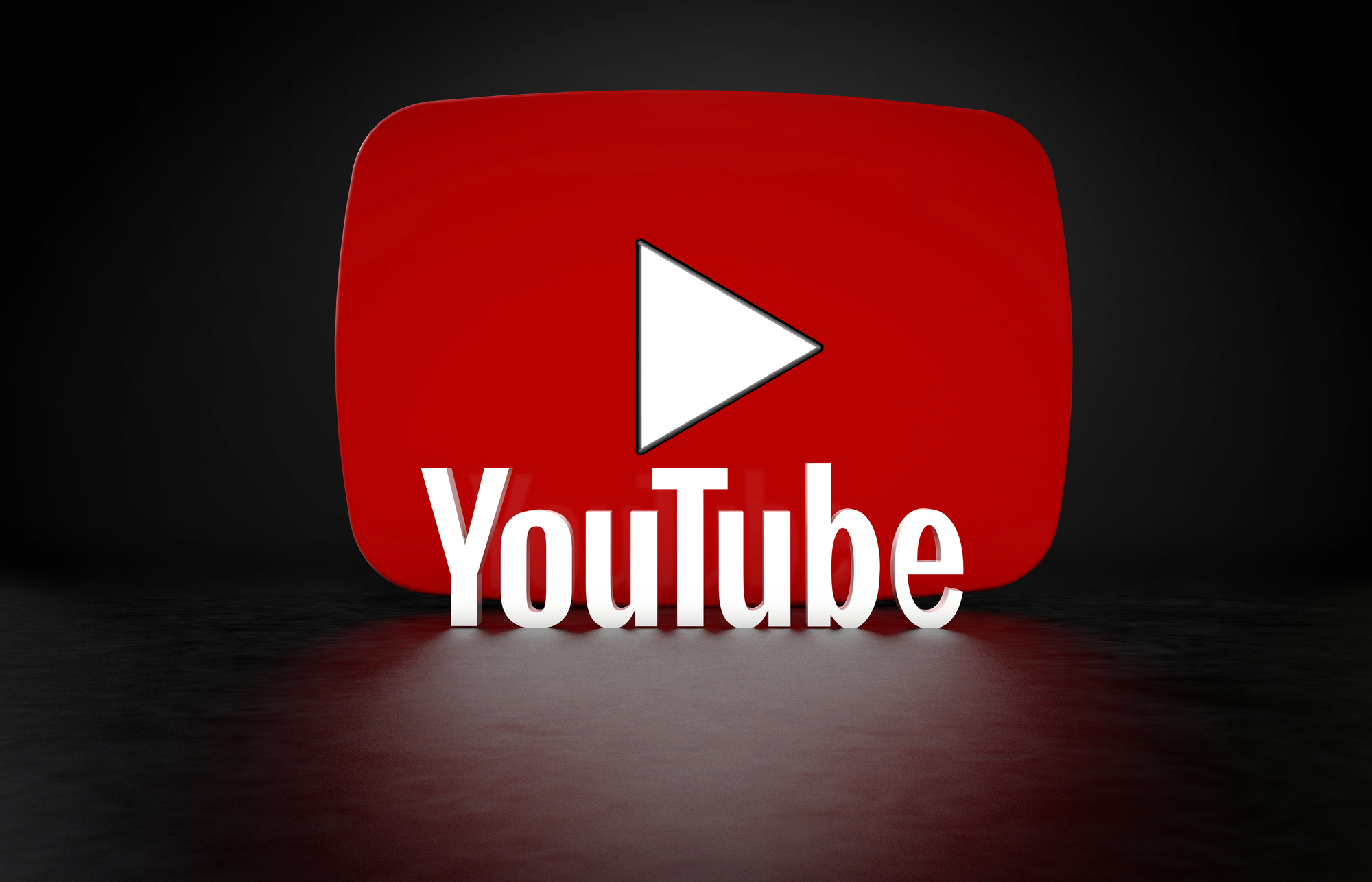 Logo YouTube en 3D sur un fond noir brillant.