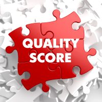 Puzzle rouge affichant le texte "Quality Score"